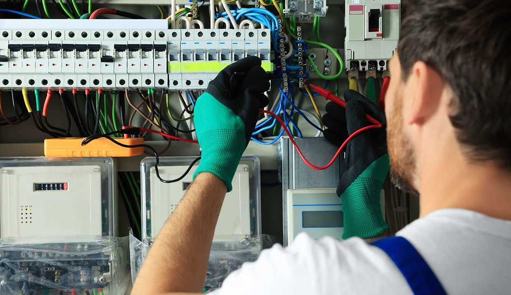 Licensed electrician inspecting a home's electrical system