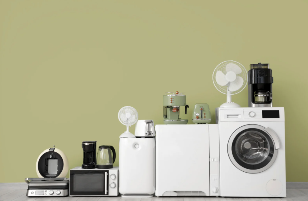 Collection of modern energy efficient home appliances including washing machine microwave and coffee maker