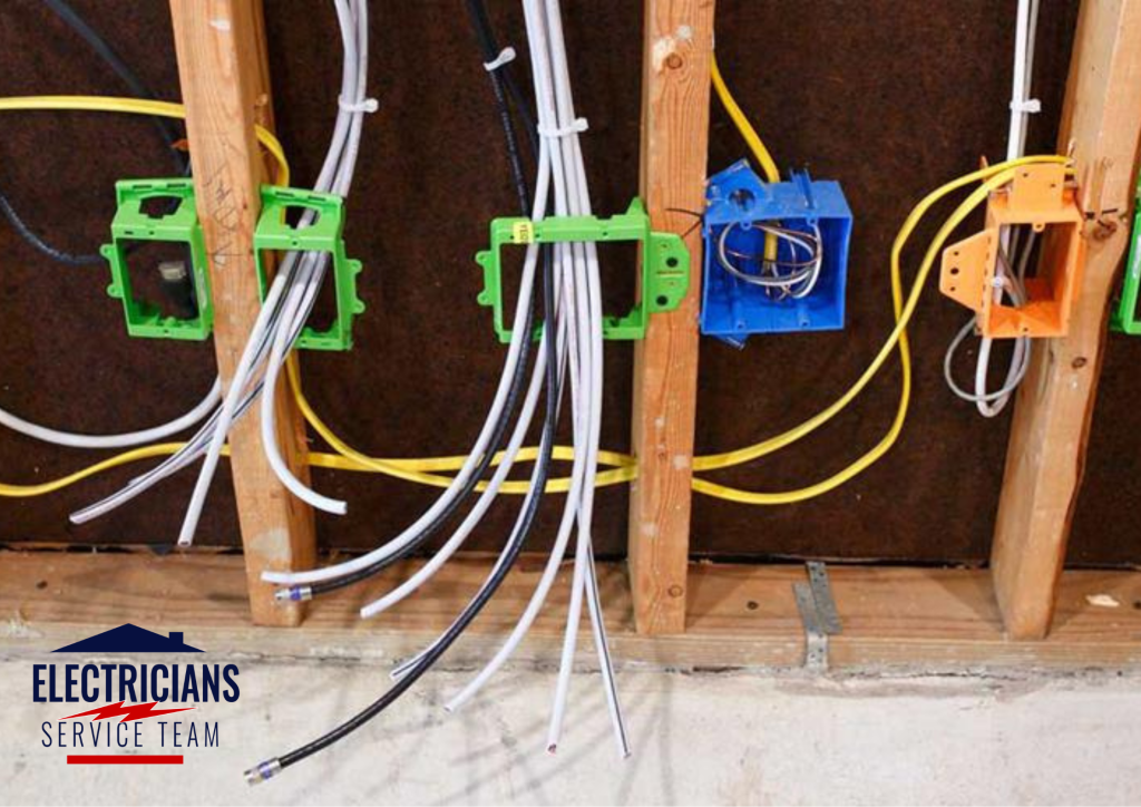 Electrician running new ground wire through wall in residential home as permanent fix for open ground outlets