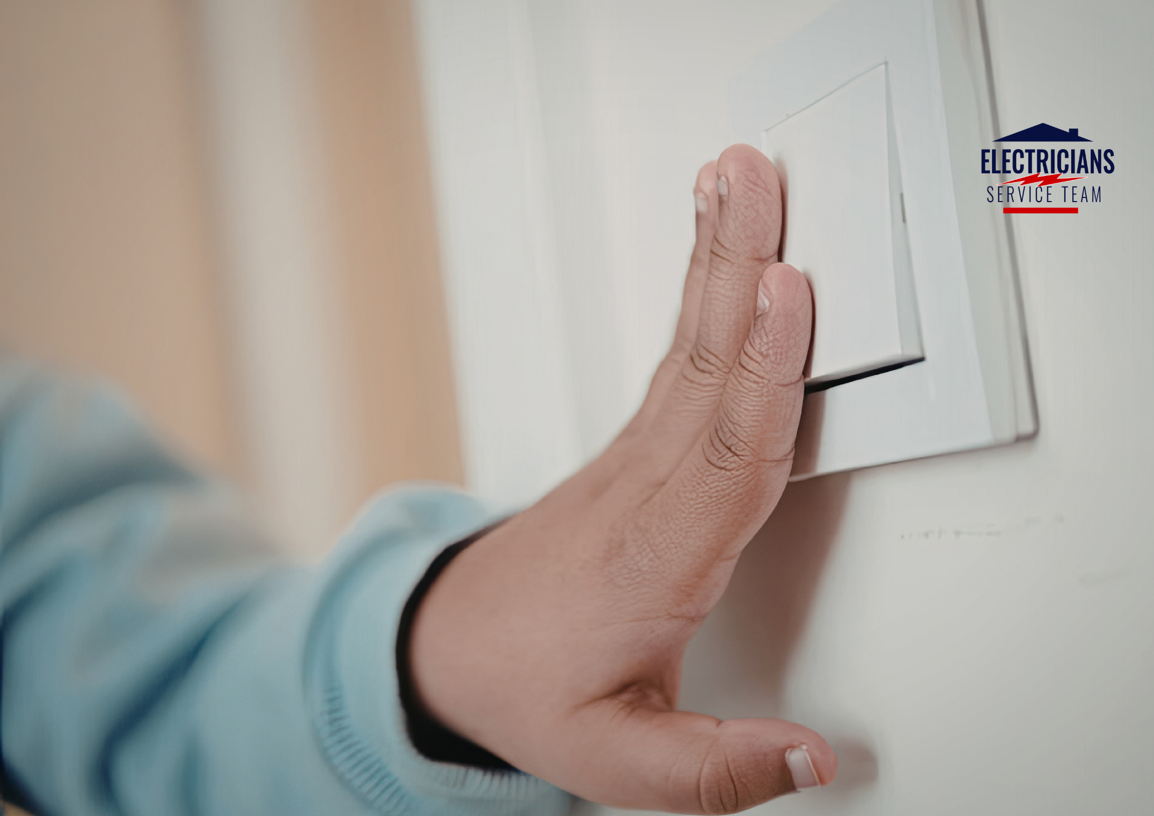 A homeowner pressing a white light switch in a dark room to troubleshoot power loss and localized electrical circuit issues.