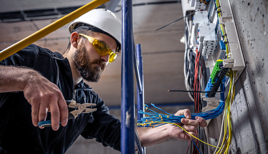 Licensed electrician inspecting a home's electrical system