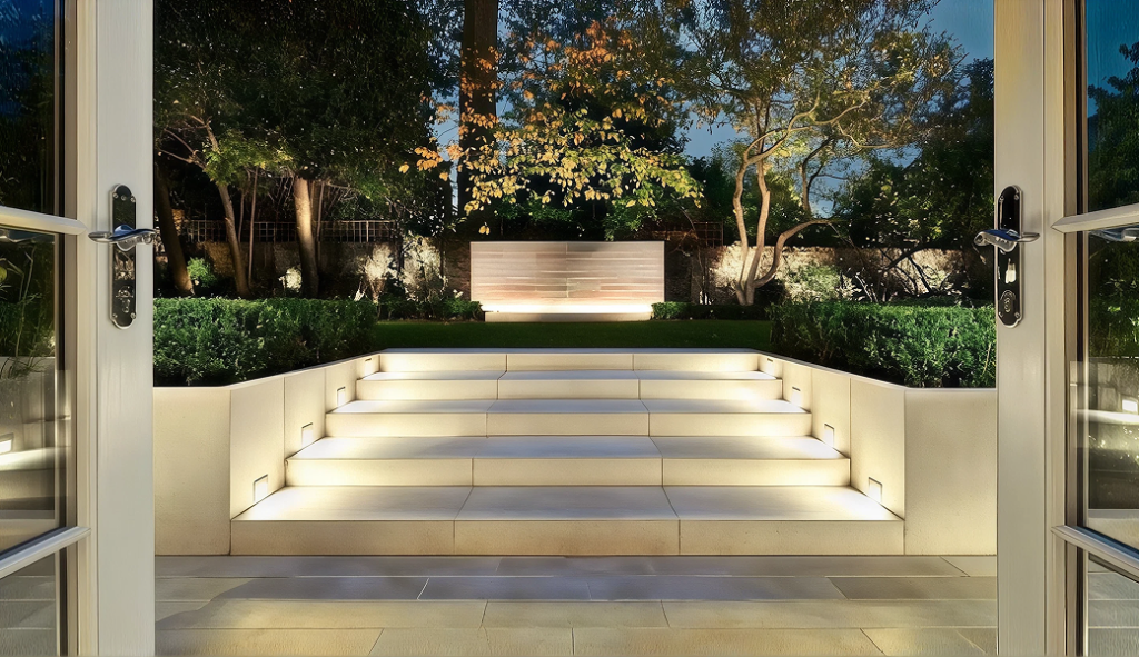 Electricians Service Team technician completing landscape lighting installation on site