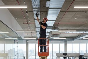 Electricians Service Team technician completing commercial electrician on site